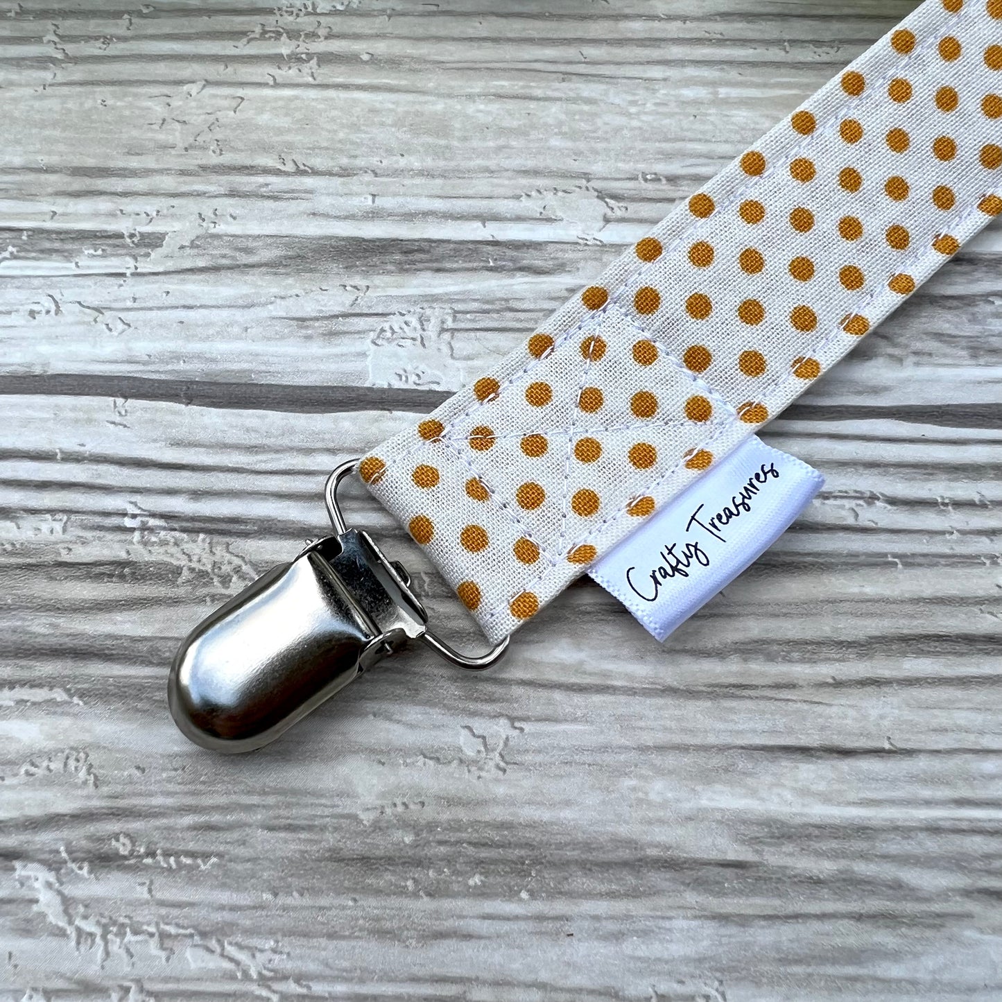 Mustard Dots Pacifier Clip