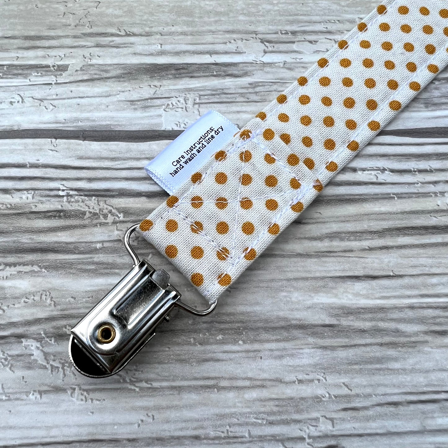 Mustard Dots Pacifier Clip