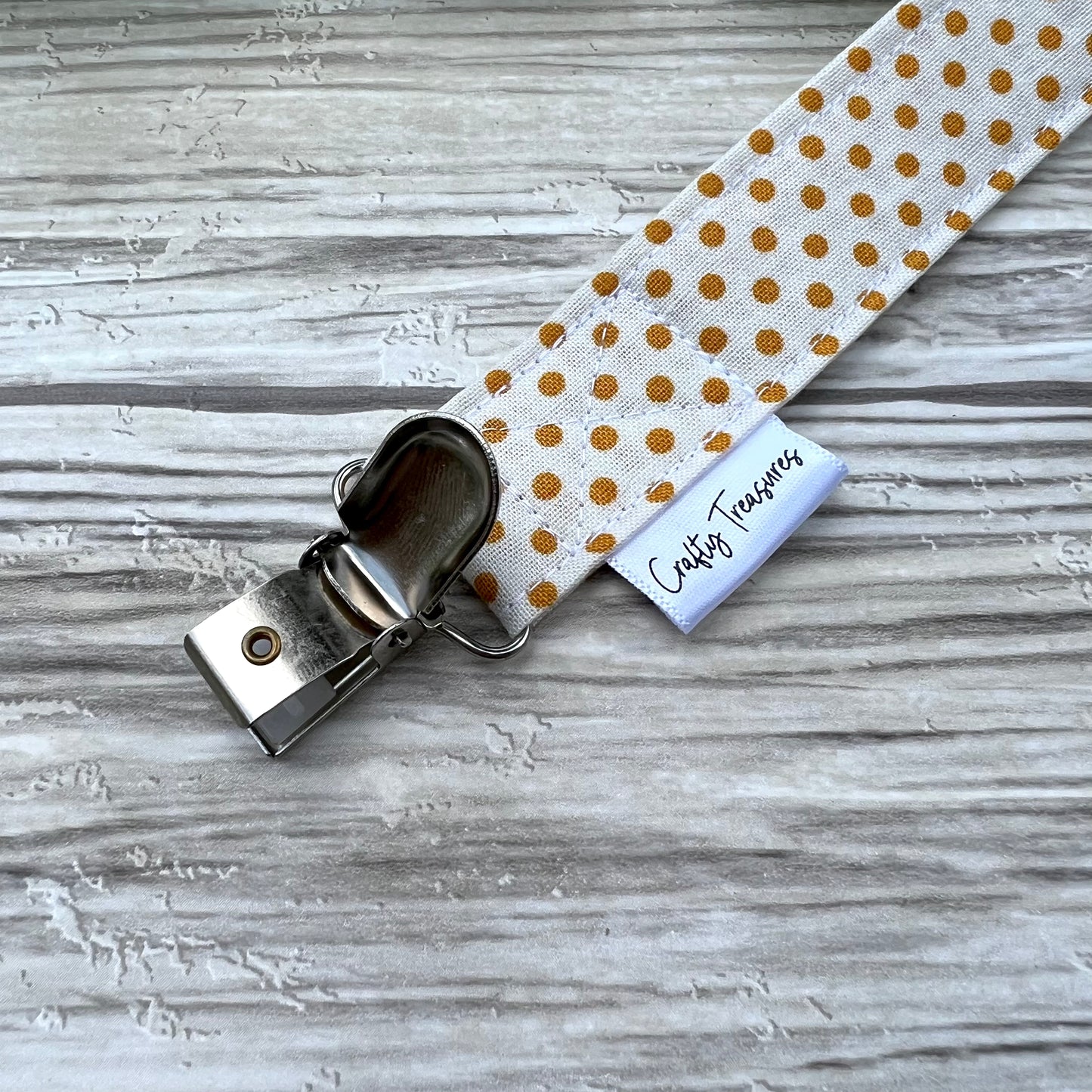 Mustard Dots Pacifier Clip