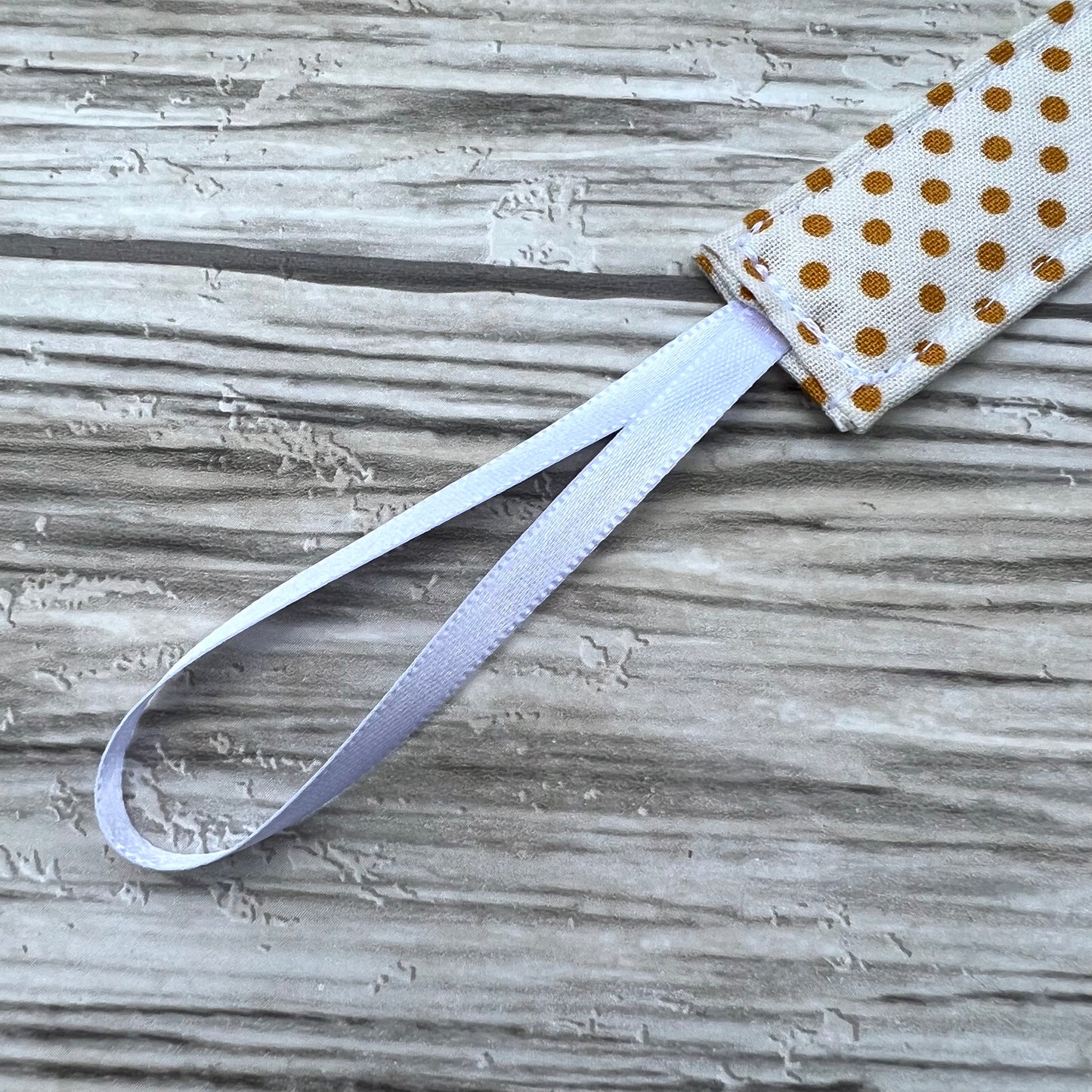 Mustard Dots Pacifier Clip